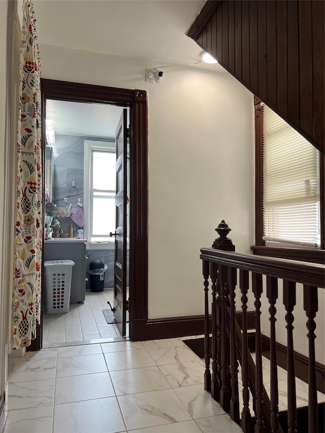 8624 79th St, Woodhaven, NY 11421 - hallway featuring marble finish flooring