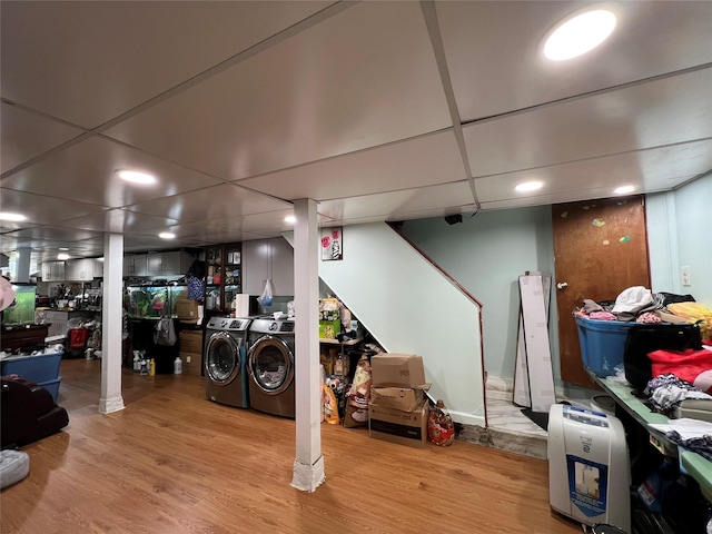8624 79th St, Woodhaven, NY 11421 - washroom featuring wood finished floors and washing machine and clothes dryer