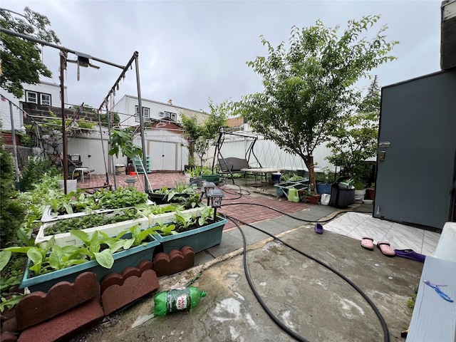 8624 79th St, Woodhaven, NY 11421 - view of patio / terrace featuring a garden