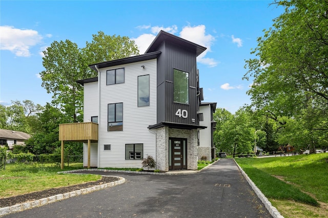 40 Singer Ave Unit 201, Spring Valley, NY 10977 - contemporary house featuring a front lawn and stone siding