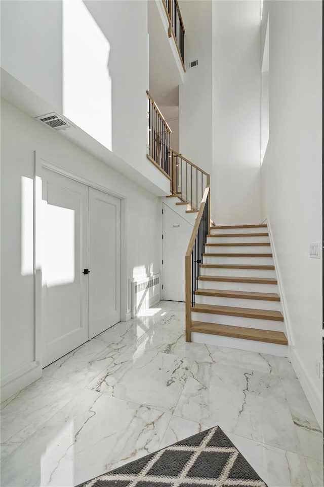40 Singer Ave Unit 201, Spring Valley, NY 10977 - foyer with marble tiled floors, stairs, and a high ceiling
