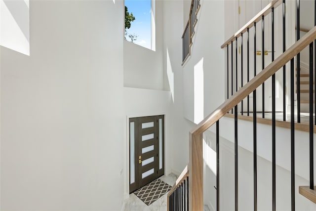 40 Singer Ave Unit 201, Spring Valley, NY 10977 - entrance foyer with a towering ceiling and stairs