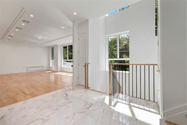 40 Singer Ave Unit 201, Spring Valley, NY 10977 - spare room featuring recessed lighting, radiator, and marble finish floors