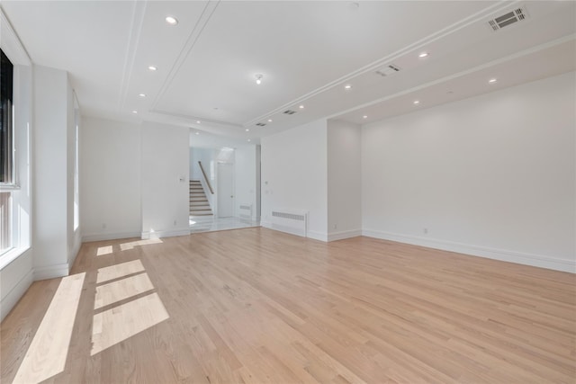 40 Singer Ave Unit 201, Spring Valley, NY 10977 - spare room featuring stairway, light wood-style flooring, recessed lighting, and a raised ceiling