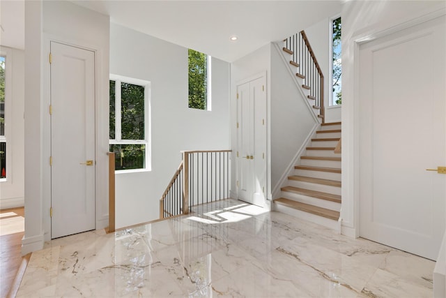 40 Singer Ave Unit 201, Spring Valley, NY 10977 - entrance foyer featuring marble tiled flooring and stairway