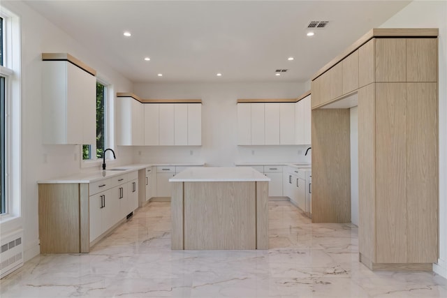 40 Singer Ave Unit 201, Spring Valley, NY 10977 - kitchen with a center island, light marble finish flooring, modern cabinets, and recessed lighting