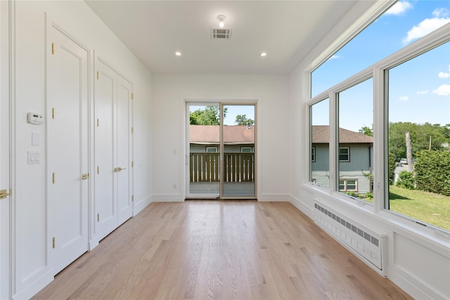40 Singer Ave Unit 201, Spring Valley, NY 10977 - unfurnished sunroom featuring radiator heating unit
