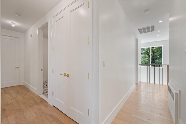40 Singer Ave Unit 201, Spring Valley, NY 10977 - hall with light wood-type flooring, radiator heating unit, and recessed lighting