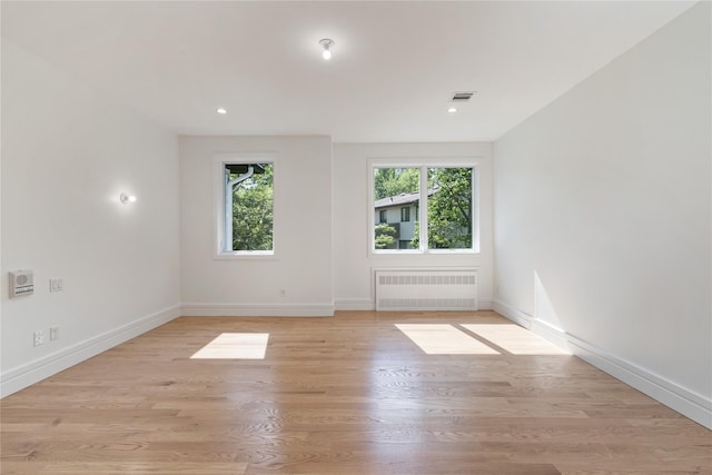 40 Singer Ave Unit 201, Spring Valley, NY 10977 - spare room featuring radiator, light wood finished floors, and recessed lighting