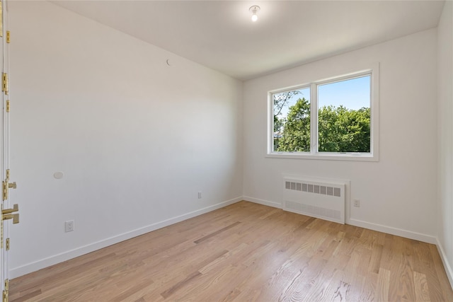 40 Singer Ave Unit 201, Spring Valley, NY 10977 - spare room featuring radiator heating unit and light wood-style floors