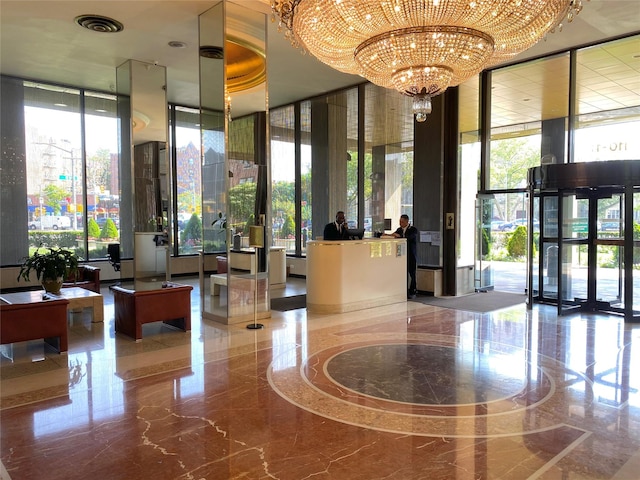 110-11 Queens Blvd Unit 27G, Forest Hills, NY 11375 - community lobby featuring floor to ceiling windows