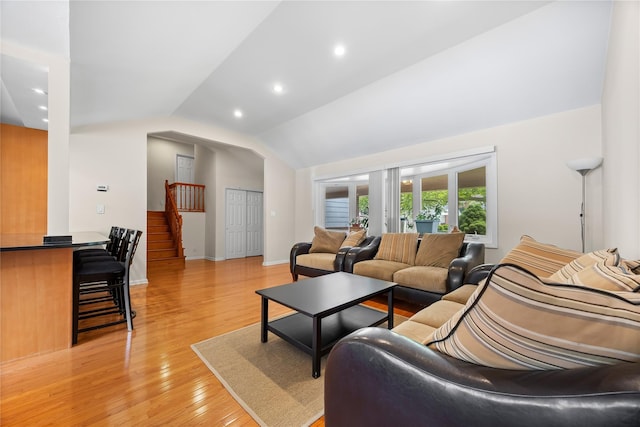 222-47 Garland Dr, Bayside, NY 11364 - living area with vaulted ceiling, stairway, light wood-style floors, french doors, and recessed lighting