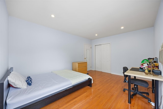 222-47 Garland Dr, Bayside, NY 11364 - bedroom featuring light wood-type flooring, a closet, recessed lighting, and baseboards