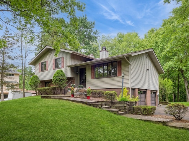 29 Sachson Pl, Wappingers Falls, NY 12590 - split level home featuring a chimney, a front lawn, a garage, and driveway