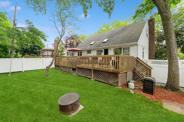 18 Hawthorne Ln, Valley Stream, NY 11581 - back of house featuring a chimney, a deck, and roof with shingles