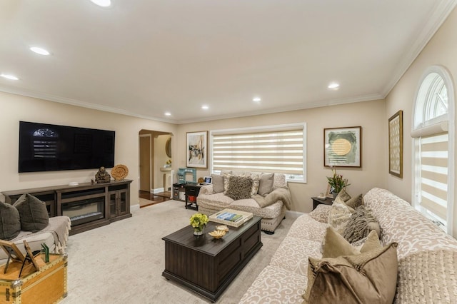 18 Hawthorne Ln, Valley Stream, NY 11581 - living room with arched walkways, ornamental molding, plenty of natural light, recessed lighting, and light carpet