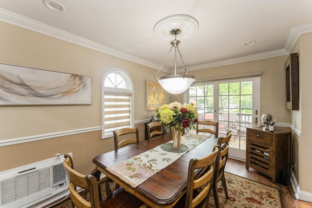 18 Hawthorne Ln, Valley Stream, NY 11581 - dining room featuring light wood finished floors, ornamental molding, a wall mounted air conditioner, and baseboards