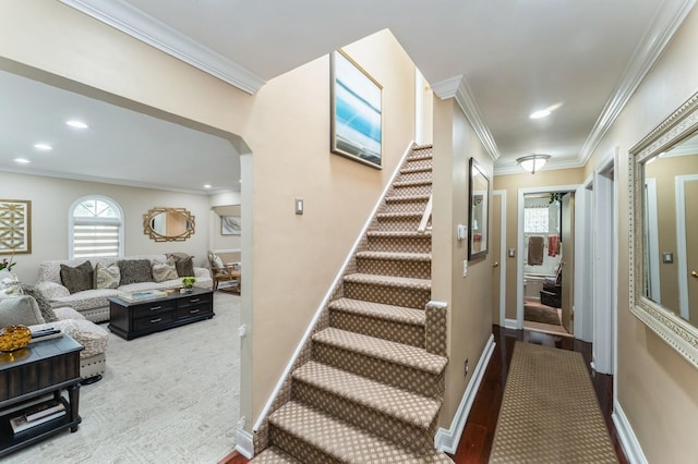 18 Hawthorne Ln, Valley Stream, NY 11581 - stairway featuring crown molding, arched walkways, baseboards, and carpet flooring