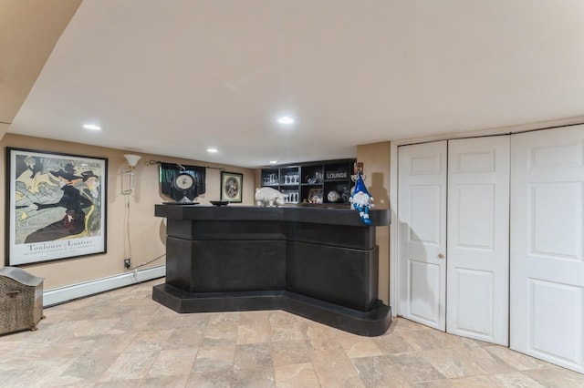 18 Hawthorne Ln, Valley Stream, NY 11581 - indoor dry bar featuring a baseboard heating unit, recessed lighting, and light stone finish floors