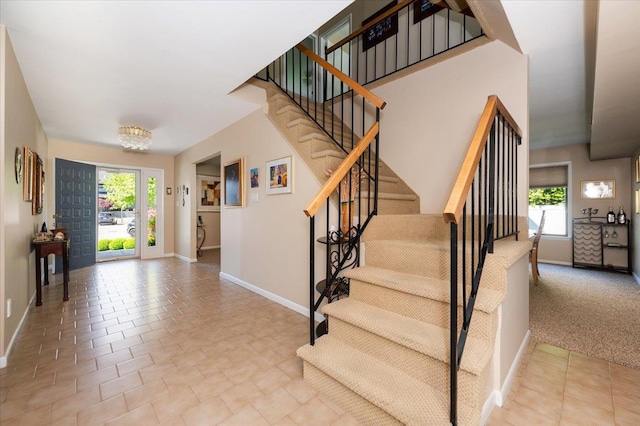 1270 Mara Ct, Atlantic Beach, NY 11509 - stairs with baseboards and tile patterned flooring