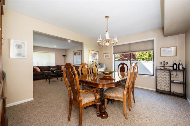 1270 Mara Ct, Atlantic Beach, NY 11509 - dining room with light carpet, a chandelier, and baseboards