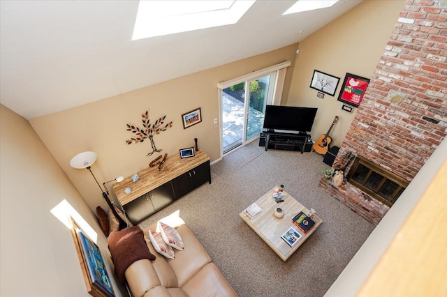 1270 Mara Ct, Atlantic Beach, NY 11509 - carpeted living area with a skylight, a brick fireplace, and high vaulted ceiling