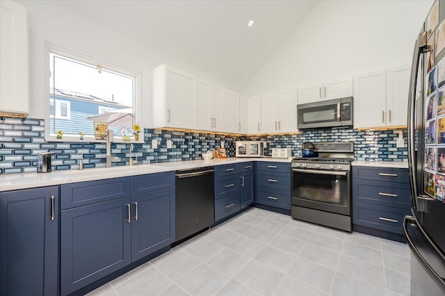 1270 Mara Ct, Atlantic Beach, NY 11509 - kitchen featuring appliances with stainless steel finishes, a sink, white cabinetry, light countertops, and decorative backsplash