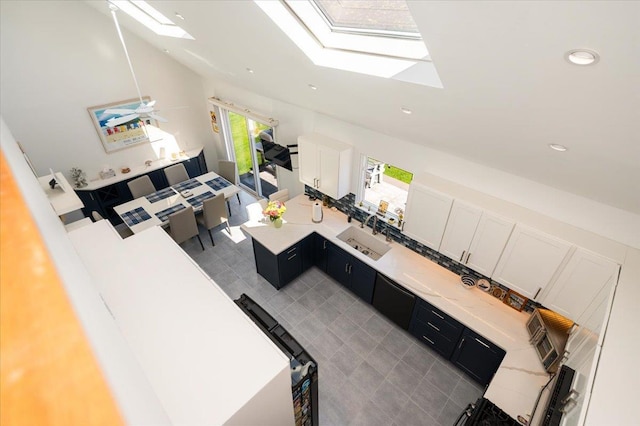 1270 Mara Ct, Atlantic Beach, NY 11509 - living room with a skylight, lofted ceiling, and recessed lighting