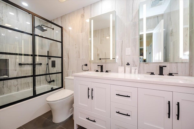 1270 Mara Ct, Atlantic Beach, NY 11509 - full bathroom with tile walls, toilet, double vanity, enclosed tub / shower combo, and tile patterned flooring