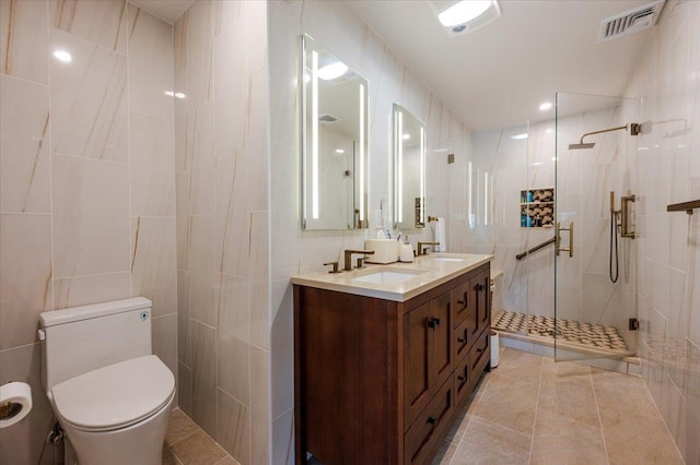 1270 Mara Ct, Atlantic Beach, NY 11509 - bathroom featuring tile walls, a shower stall, double vanity, toilet, and tile patterned flooring