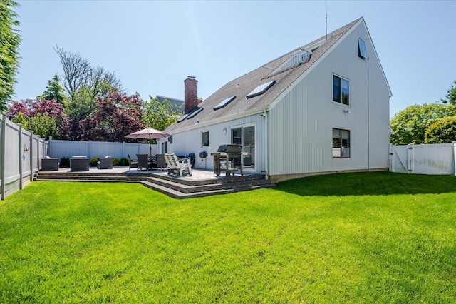 1270 Mara Ct, Atlantic Beach, NY 11509 - rear view of house featuring a patio area, a chimney, and a gate