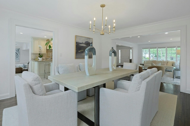 15 Old Farm Rd, Scarsdale, NY 10583 - dining space with a chandelier, dark wood finished floors, crown molding, and recessed lighting