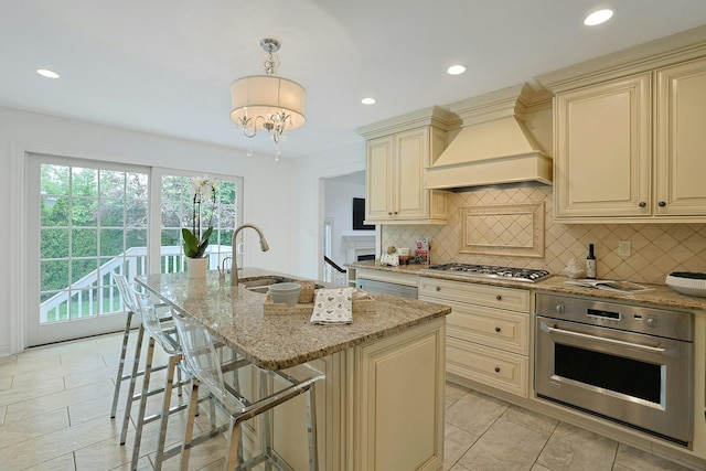 15 Old Farm Rd, Scarsdale, NY 10583 - kitchen featuring cream cabinets, stainless steel appliances, custom exhaust hood, light stone countertops, and decorative backsplash