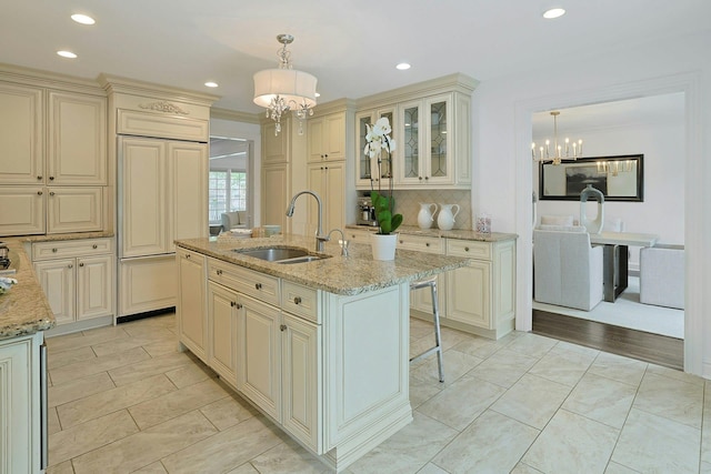 15 Old Farm Rd, Scarsdale, NY 10583 - kitchen featuring a chandelier, a sink, cream cabinets, recessed lighting, and ornamental molding