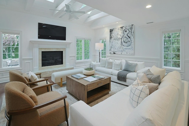 15 Old Farm Rd, Scarsdale, NY 10583 - living room featuring a decorative wall, healthy amount of natural light, a tile fireplace, a ceiling fan, and wainscoting