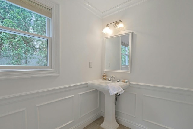 15 Old Farm Rd, Scarsdale, NY 10583 - bathroom with a decorative wall, crown molding, and wainscoting