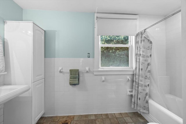 102 Broadway, Dobbs Ferry, NY 10522 - bathroom with tile walls, shower / bath combination with curtain, and a wainscoted wall