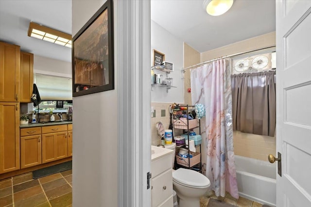 102 Broadway, Dobbs Ferry, NY 10522 - bathroom featuring vanity, toilet, tile walls, shower / tub combo, and healthy amount of natural light