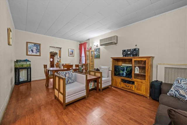 2140 Story Ave, Bronx, NY 10473 - living area with a wall mounted air conditioner, wood finished floors, and ornamental molding