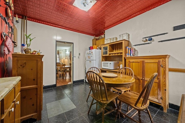 2140 Story Ave, Bronx, NY 10473 - dining room with an ornate ceiling, baseboards, and ornamental molding