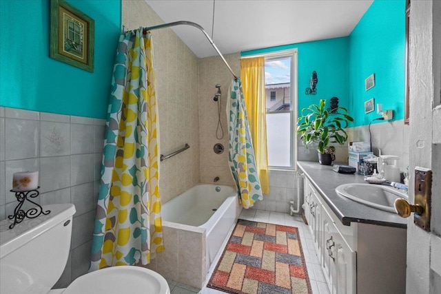 2140 Story Ave, Bronx, NY 10473 - full bathroom featuring tile walls, shower / tub combo, toilet, vanity, and a wainscoted wall