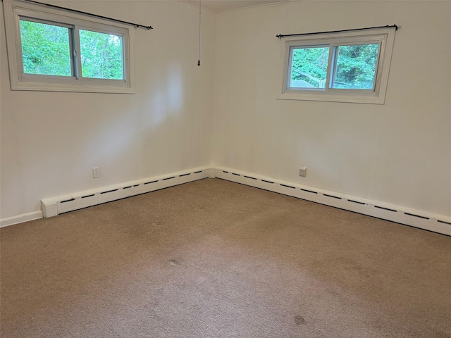 118 Truberg Ave, Patchogue, NY 11772 - spare room with a baseboard heating unit, carpet, and baseboards