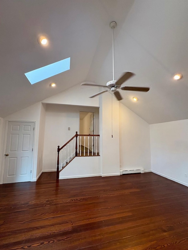118 Truberg Ave, Patchogue, NY 11772 - additional living space with a skylight, vaulted ceiling, ceiling fan, wood finished floors, and a baseboard radiator