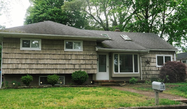 118 Truberg Ave, Patchogue, NY 11772 - tri-level home featuring a front lawn and a shingled roof