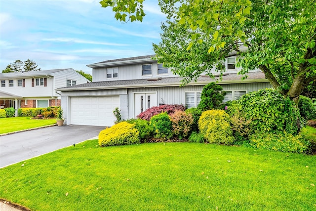 36 Randy Ln, Plainview, NY 11803 - view of front of house with asphalt driveway, a front yard, and a garage