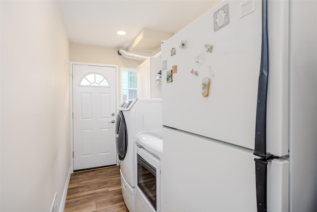 36 Randy Ln, Plainview, NY 11803 - laundry room featuring separate washer and dryer, light wood-style flooring, recessed lighting, and baseboards