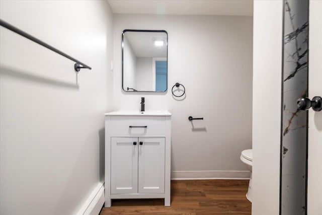23 Lincoln St, Elmont, NY 11003 - full bathroom with vanity, wood finished floors, toilet, baseboards, and a marble finish shower