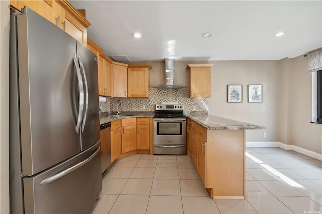 425 Shore Rd Unit 2B, Long Beach, NY 11561 - kitchen featuring appliances with stainless steel finishes, wall chimney range hood, a peninsula, light tile patterned floors, and tasteful backsplash