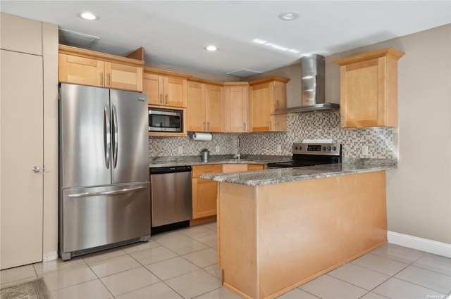 425 Shore Rd Unit 2B, Long Beach, NY 11561 - kitchen featuring appliances with stainless steel finishes, wall chimney exhaust hood, light brown cabinetry, decorative backsplash, and recessed lighting