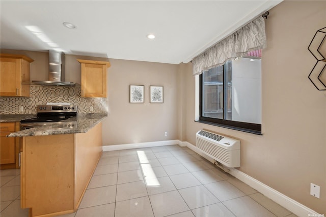425 Shore Rd Unit 2B, Long Beach, NY 11561 - kitchen with wall chimney exhaust hood, stainless steel electric stove, tasteful backsplash, light tile patterned floors, and a peninsula
